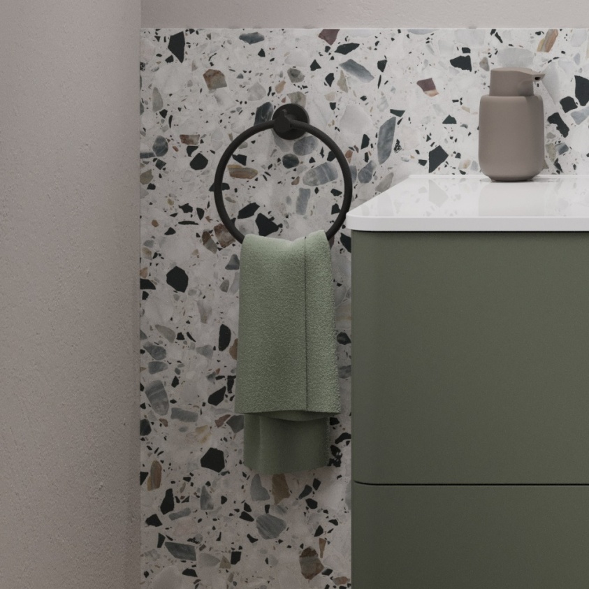 product lifestyle image of Britton Hoxton 2.0 Matt Black Towel Ring front angle on terrazzo wall HOX013M